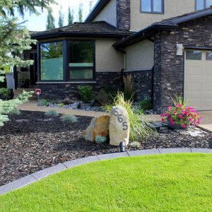 Residential Front yard landscaping with sod and shrubs