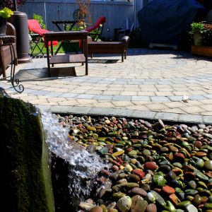 Backyard patio with fountain water feature