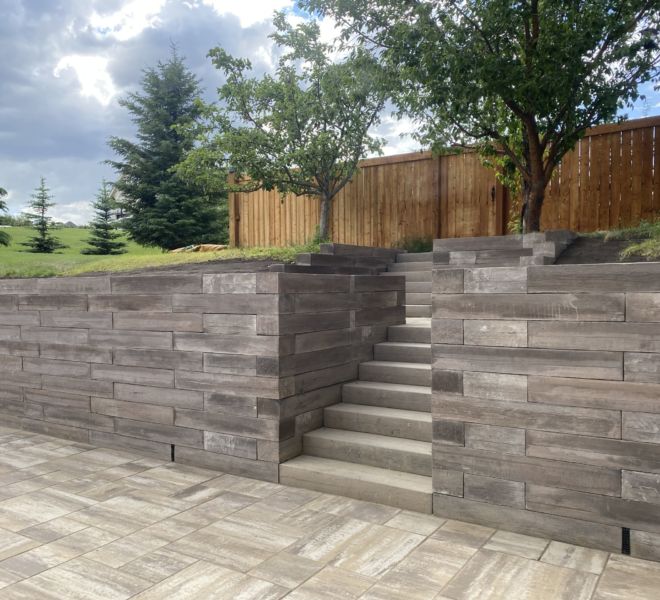 Stone patio with steps and retaining wall