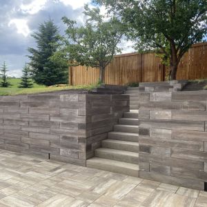 Stone patio with steps and retaining wall